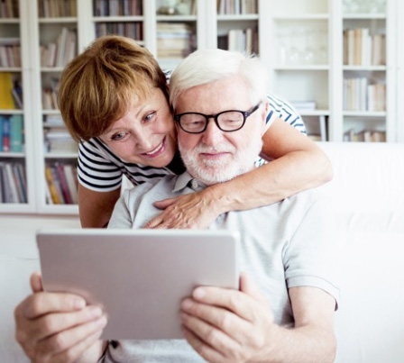 Image shows a couple using patient access at home